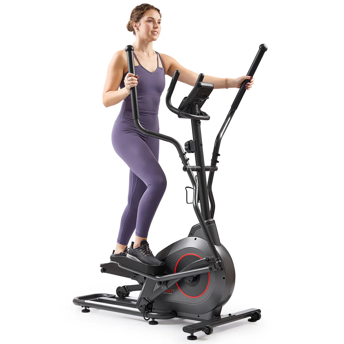 Woman exercising on a black elliptical machine against a white background