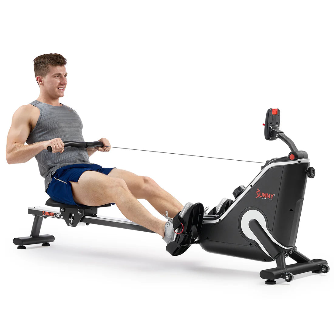 Man using the smart magnetic rowing machine